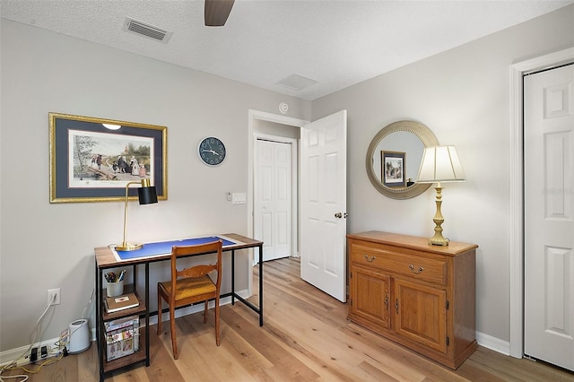 8545 SE 168th Kittredge Loop, The Villages, FL 32162 - office space featuring light wood-style floors, ceiling fan, and a textured ceiling