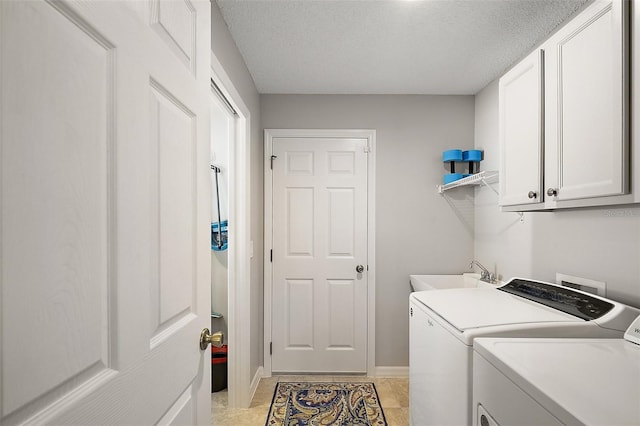 8545 SE 168th Kittredge Loop, The Villages, FL 32162 - washroom featuring washer and clothes dryer, cabinet space, and a textured ceiling