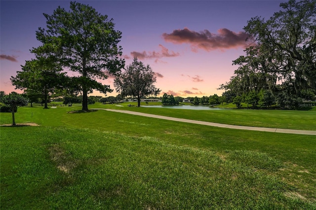 8545 SE 168th Kittredge Loop, The Villages, FL 32162 - view of property's community featuring a water view, a yard, and view of golf course