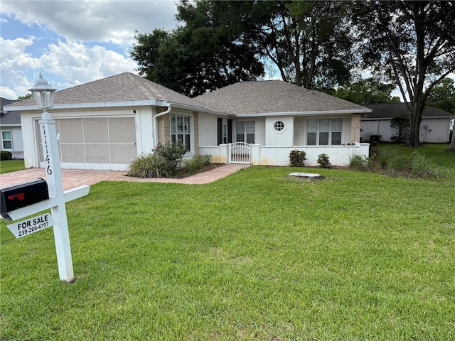 11146 SW 68th Ct, Ocala, FL 34476 - ranch-style house featuring driveway, roof with shingles, a front yard, a gate, and an attached garage