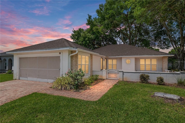 11146 SW 68th Ct, Ocala, FL 34476 - ranch-style house with a garage, a front lawn, stucco siding, a gate, and driveway