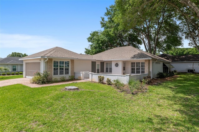 11146 SW 68th Ct, Ocala, FL 34476 - ranch-style house with decorative driveway, an attached garage, fence private yard, and a front lawn