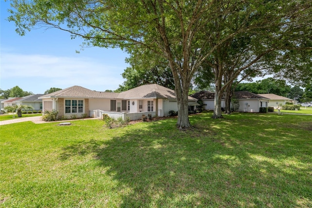 11146 SW 68th Ct, Ocala, FL 34476 - ranch-style house with stucco siding and a front yard