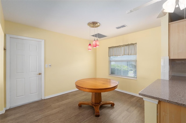 11146 SW 68th Ct, Ocala, FL 34476 - dining room featuring baseboards, a ceiling fan, wood finished floors, and visible vents