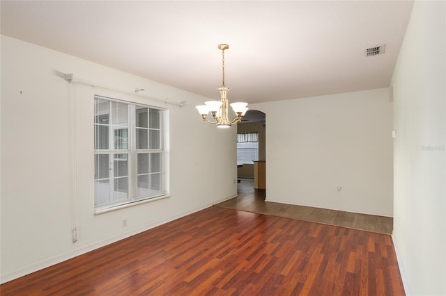 11146 SW 68th Ct, Ocala, FL 34476 - unfurnished room featuring baseboards, a notable chandelier, wood finished floors, and visible vents