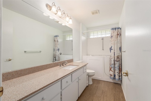 11146 SW 68th Ct, Ocala, FL 34476 - bathroom featuring visible vents, vanity, wood finished floors, toilet, and shower / bathtub combination with curtain