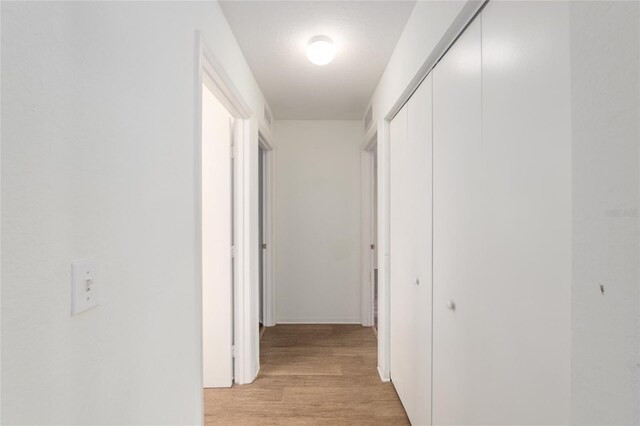 11146 SW 68th Ct, Ocala, FL 34476 - hallway featuring visible vents and light wood finished floors