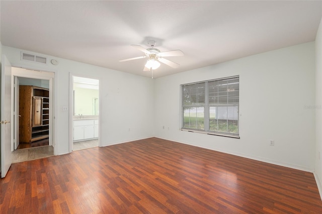 11146 SW 68th Ct, Ocala, FL 34476 - empty room with visible vents, a sink, wood finished floors, baseboards, and a ceiling fan