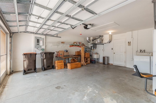 11146 SW 68th Ct, Ocala, FL 34476 - garage featuring a sink, a garage door opener, washer / clothes dryer, and electric panel
