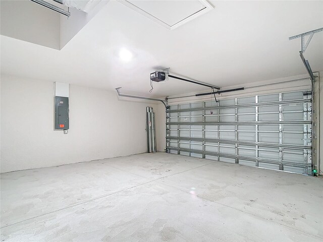 garage featuring a garage door opener and electric panel