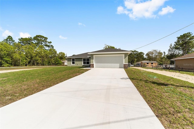 532 W Homeway Loop, Citrus Springs, FL 34434 - single story home featuring driveway, stucco siding, a garage, and stone siding