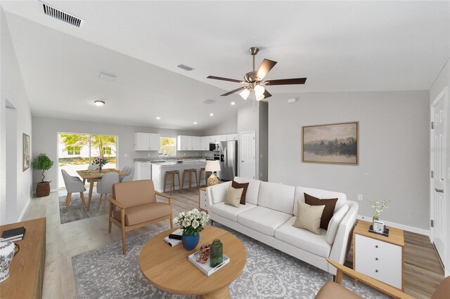 532 W Homeway Loop, Citrus Springs, FL 34434 - living area with lofted ceiling, light wood-type flooring, ceiling fan, baseboards, and recessed lighting