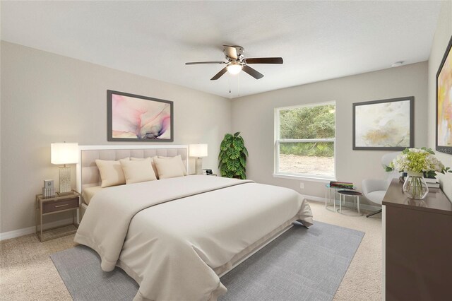 bedroom with baseboards, a ceiling fan, and light colored carpet