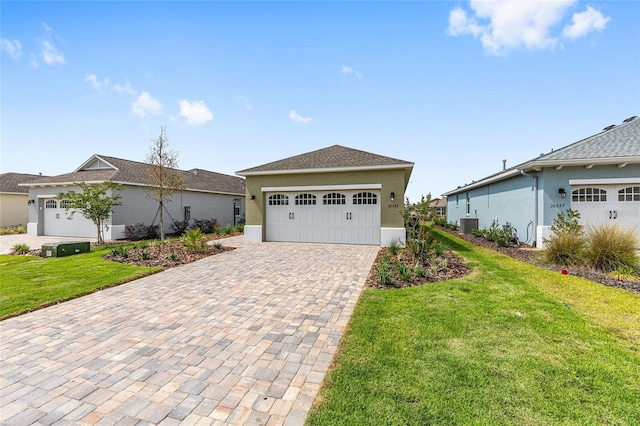 10347 SW 99th Ln, Ocala, FL 34481 - ranch-style house with a front lawn, stucco siding, cooling unit, and driveway