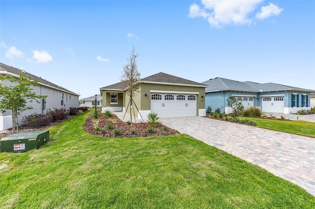 10347 SW 99th Ln, Ocala, FL 34481 - ranch-style home with stucco siding, an attached garage, a front yard, and decorative driveway