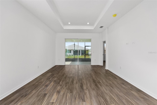 10347 SW 99th Ln, Ocala, FL 34481 - spare room with dark wood finished floors, a raised ceiling, baseboards, recessed lighting, and a smoke detector