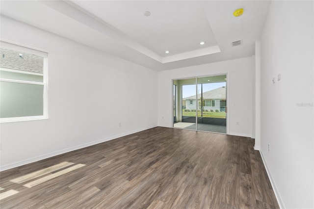 10347 SW 99th Ln, Ocala, FL 34481 - unfurnished room featuring dark wood-type flooring, baseboards, a raised ceiling, a smoke detector, and recessed lighting