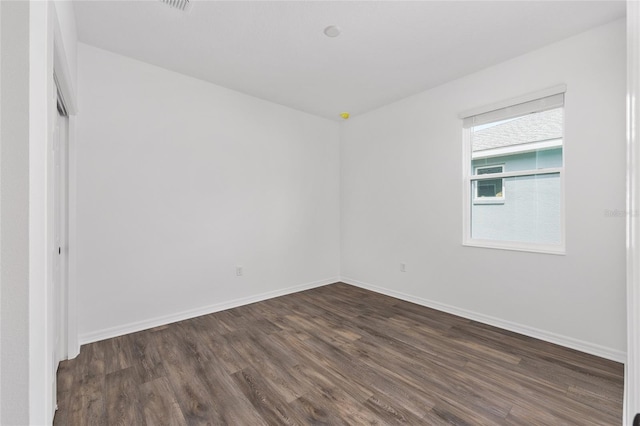 10347 SW 99th Ln, Ocala, FL 34481 - empty room with dark wood-style floors and baseboards