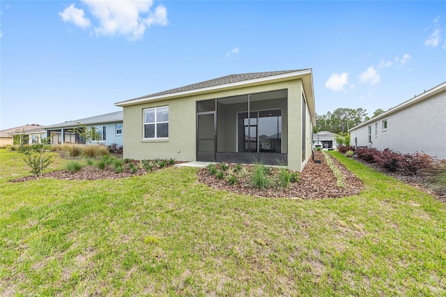 10347 SW 99th Ln, Ocala, FL 34481 - back of property featuring a sunroom, a lawn, and stucco siding
