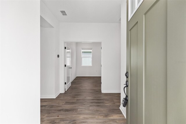 10347 SW 99th Ln, Ocala, FL 34481 - entryway with baseboards and dark wood-style flooring