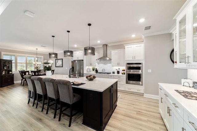 10082 SW 82nd Place Rd, Ocala, FL 34481 - kitchen featuring stainless steel appliances, wall chimney range hood, ornamental molding, light countertops, and tasteful backsplash