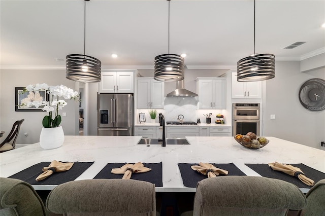 10082 SW 82nd Place Rd, Ocala, FL 34481 - kitchen featuring appliances with stainless steel finishes, a sink, ornamental molding, light stone counters, and recessed lighting