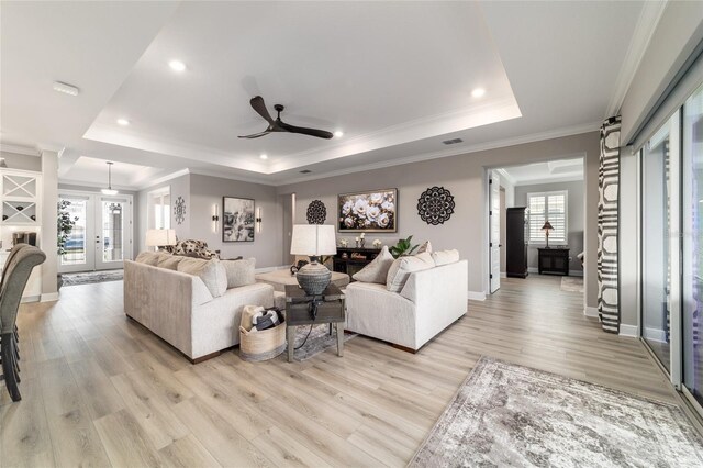 10082 SW 82nd Place Rd, Ocala, FL 34481 - living area with a raised ceiling, ceiling fan, light wood-type flooring, recessed lighting, and ornamental molding