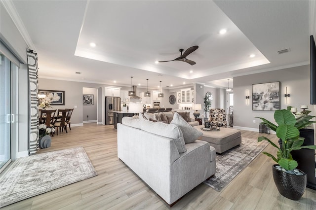 10082 SW 82nd Place Rd, Ocala, FL 34481 - living area featuring a raised ceiling, ceiling fan, baseboards, light wood-type flooring, and recessed lighting
