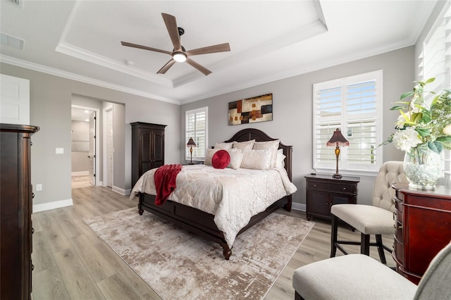 10082 SW 82nd Place Rd, Ocala, FL 34481 - bedroom featuring a raised ceiling, light wood finished floors, ornamental molding, baseboards, and ceiling fan