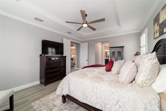 10082 SW 82nd Place Rd, Ocala, FL 34481 - bedroom with a tray ceiling, light wood-type flooring, ornamental molding, baseboards, and ceiling fan