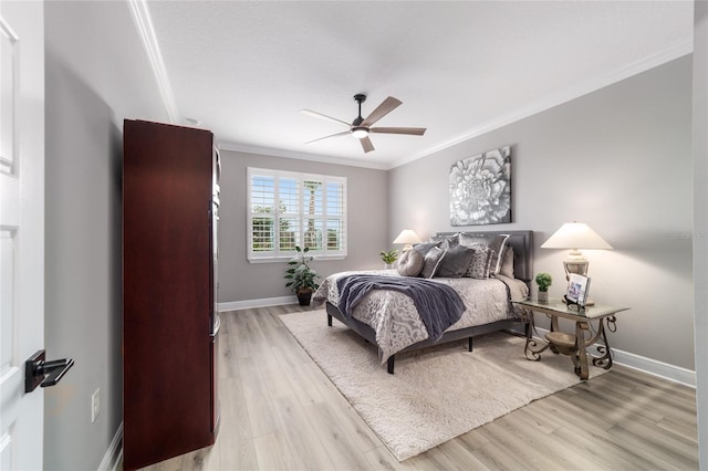 10082 SW 82nd Place Rd, Ocala, FL 34481 - bedroom with crown molding, light wood-type flooring, baseboards, and a ceiling fan