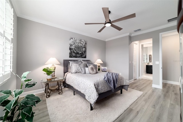 10082 SW 82nd Place Rd, Ocala, FL 34481 - bedroom with ornamental molding, light wood finished floors, baseboards, ceiling fan, and ensuite bath