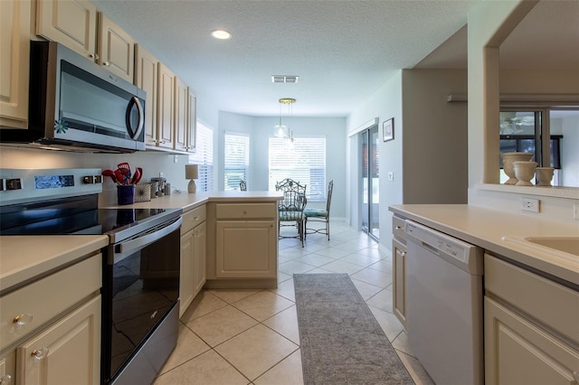 15691 SW 11th Court Rd, Ocala, FL 34473 - kitchen with visible vents, light countertops, a peninsula, and stainless steel appliances