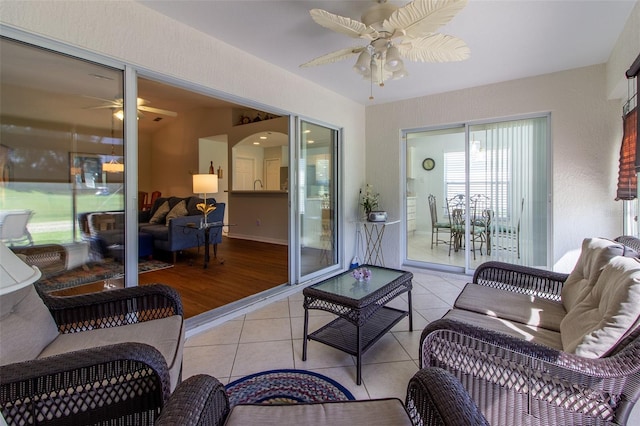 15691 SW 11th Court Rd, Ocala, FL 34473 - tiled living area featuring arched walkways and a ceiling fan