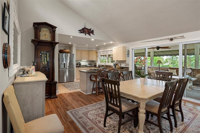 536 NW 7th Ave, Crystal River, FL 34428 - dining space with wood finished floors, recessed lighting, a textured ceiling, a ceiling fan, and vaulted ceiling