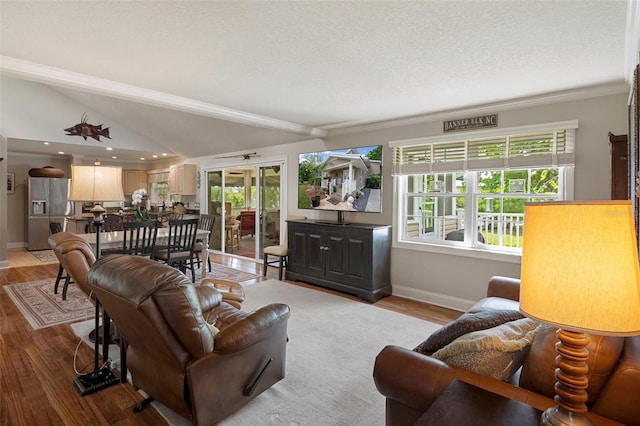 536 NW 7th Ave, Crystal River, FL 34428 - living room with baseboards, lofted ceiling, and light wood-type flooring