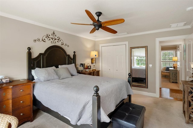 536 NW 7th Ave, Crystal River, FL 34428 - bedroom with crown molding, ceiling fan, light colored carpet, baseboards, and a closet