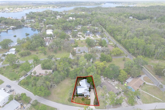 536 NW 7th Ave, Crystal River, FL 34428 - drone / aerial view featuring a water view, a residential view, and a wooded view