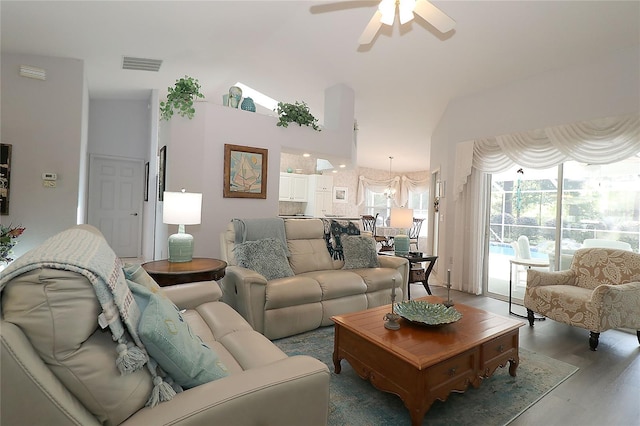 living room with visible vents, ceiling fan, and wood finished floors