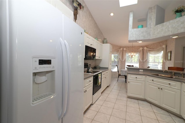kitchen featuring range with electric cooktop, black microwave, dark countertops, a sink, and white fridge with ice dispenser