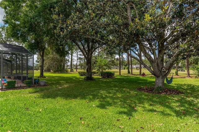 view of yard featuring a lanai