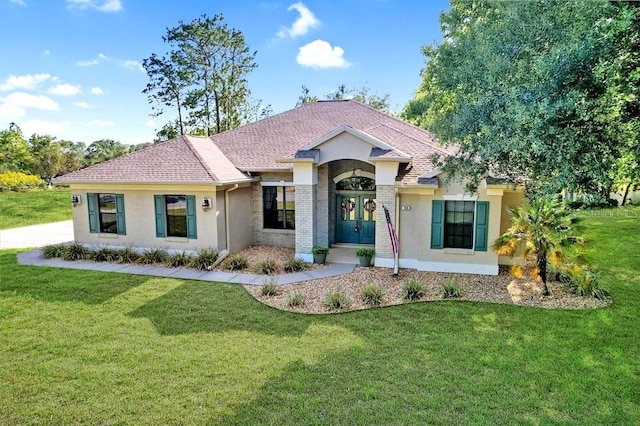 view of front of property featuring french doors and a front yard