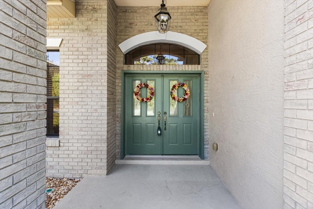 property entrance with brick siding