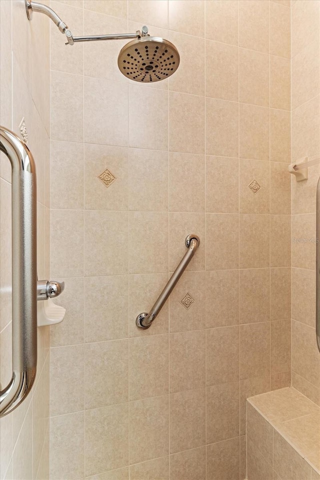 bathroom with a tile shower