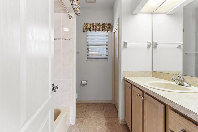 full bathroom featuring vanity, tile patterned flooring, bathing tub / shower combination, toilet, and baseboards