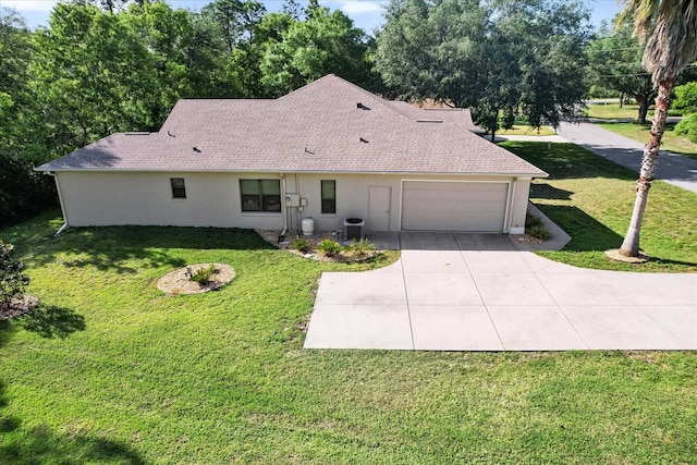 single story home with an attached garage, stucco siding, central air condition unit, and a front yard