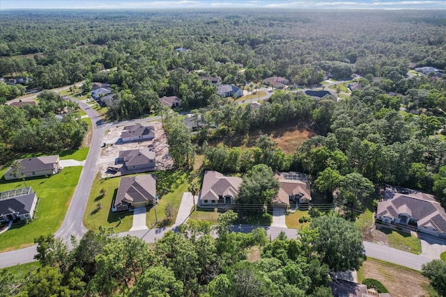 aerial view with a residential view and a wooded view