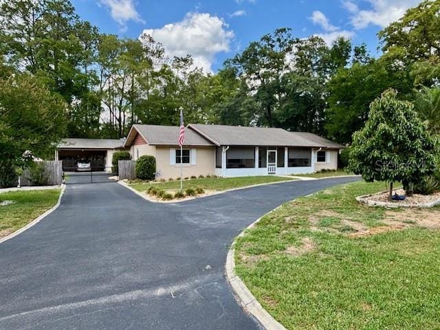 4145 SE 3rd St, Ocala, FL 34471 - ranch-style home with stucco siding and aphalt driveway