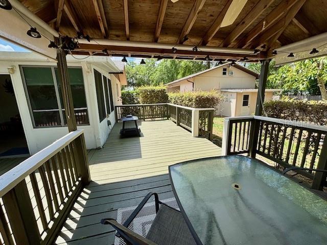 4145 SE 3rd St, Ocala, FL 34471 - wooden deck with outdoor dining area