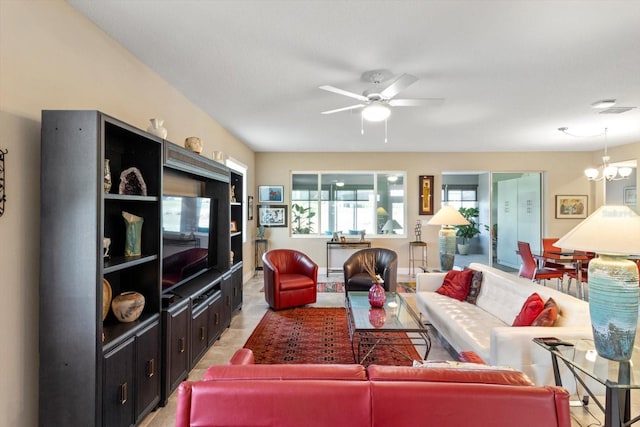 living room featuring ceiling fan with notable chandelier